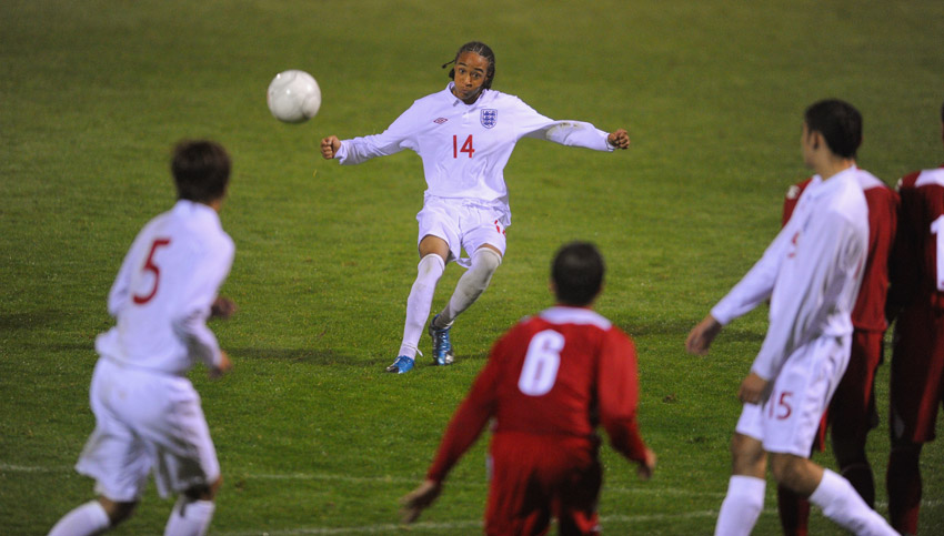 Nathan Redmond (No.14) clips a ball into the box against Wales at Huish Park.
